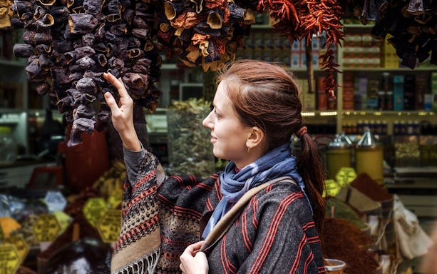 Woman exploring spice market on Istanbul Asian Side Walking Tour.