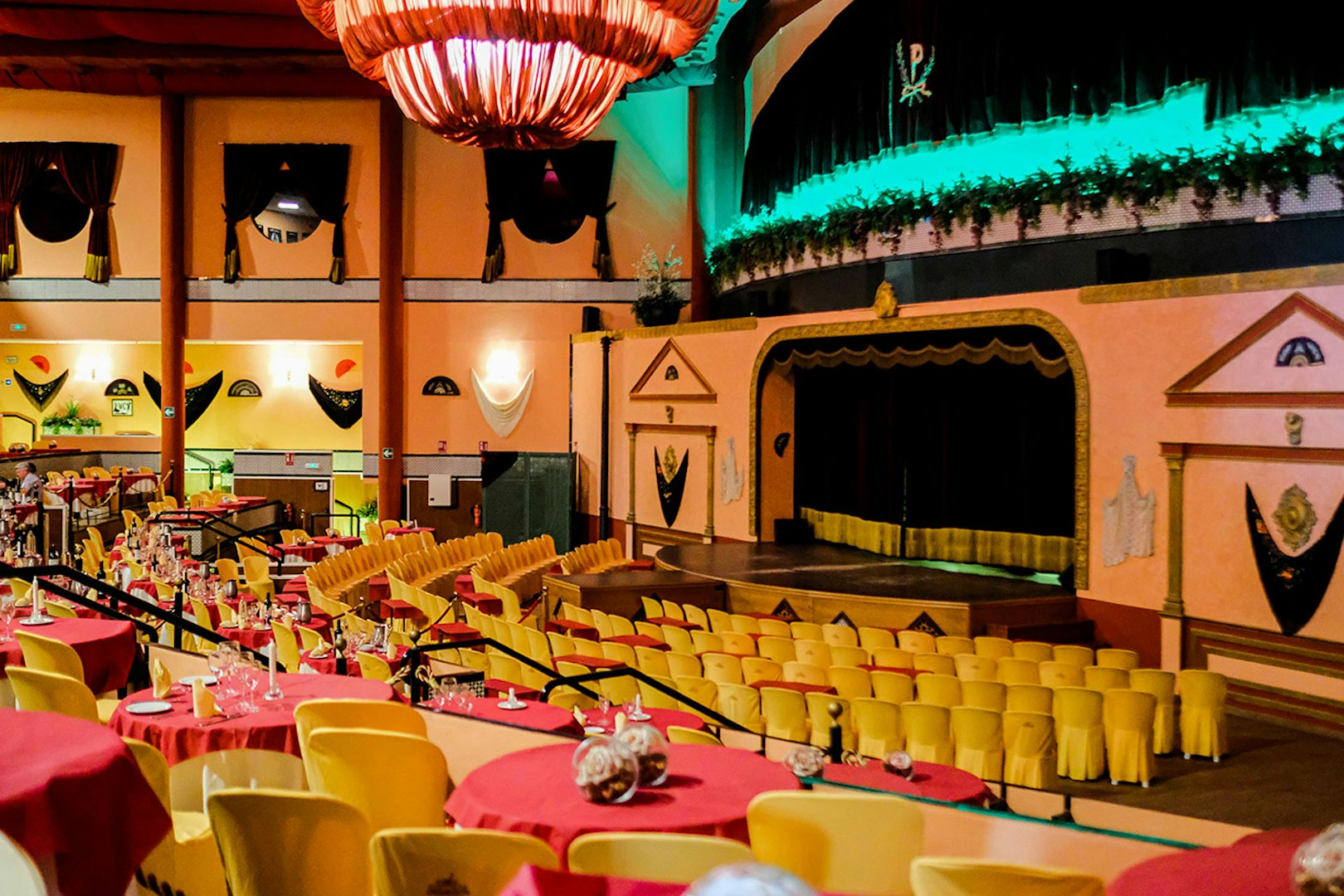 Stage area set for a Flamenco show at El Palacio Andaluz, with tables and chairs arranged for guests.