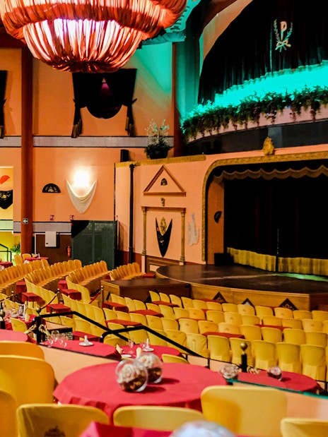 Stage area set for a Flamenco show at El Palacio Andaluz, with tables and chairs arranged for guests.