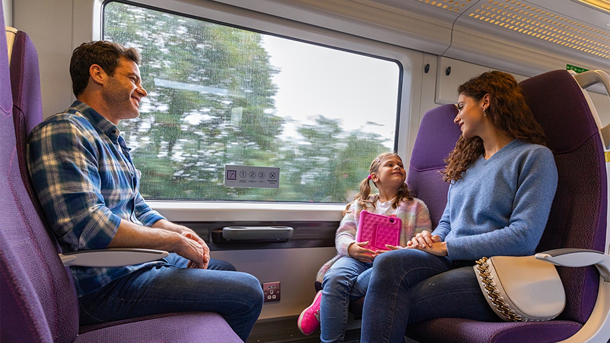 Family enjoying train ride from Heathrow Airport.