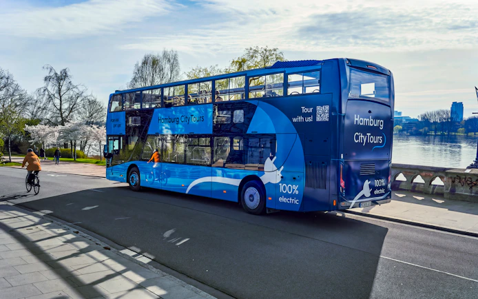 Hop-On Hop-Off bus on Hamburg city tour near Alster Lake.