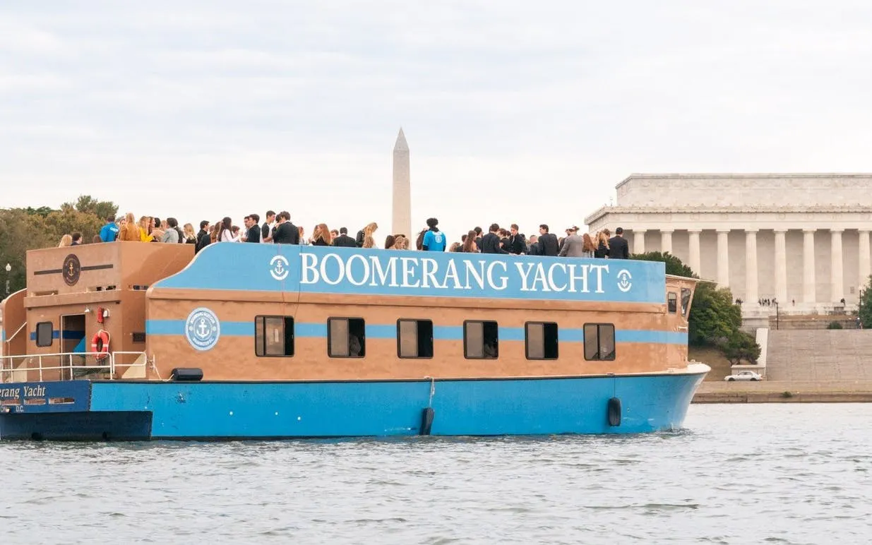 Yacht cruise with guests near Washington Monument and Lincoln Memorial, Washington, DC.