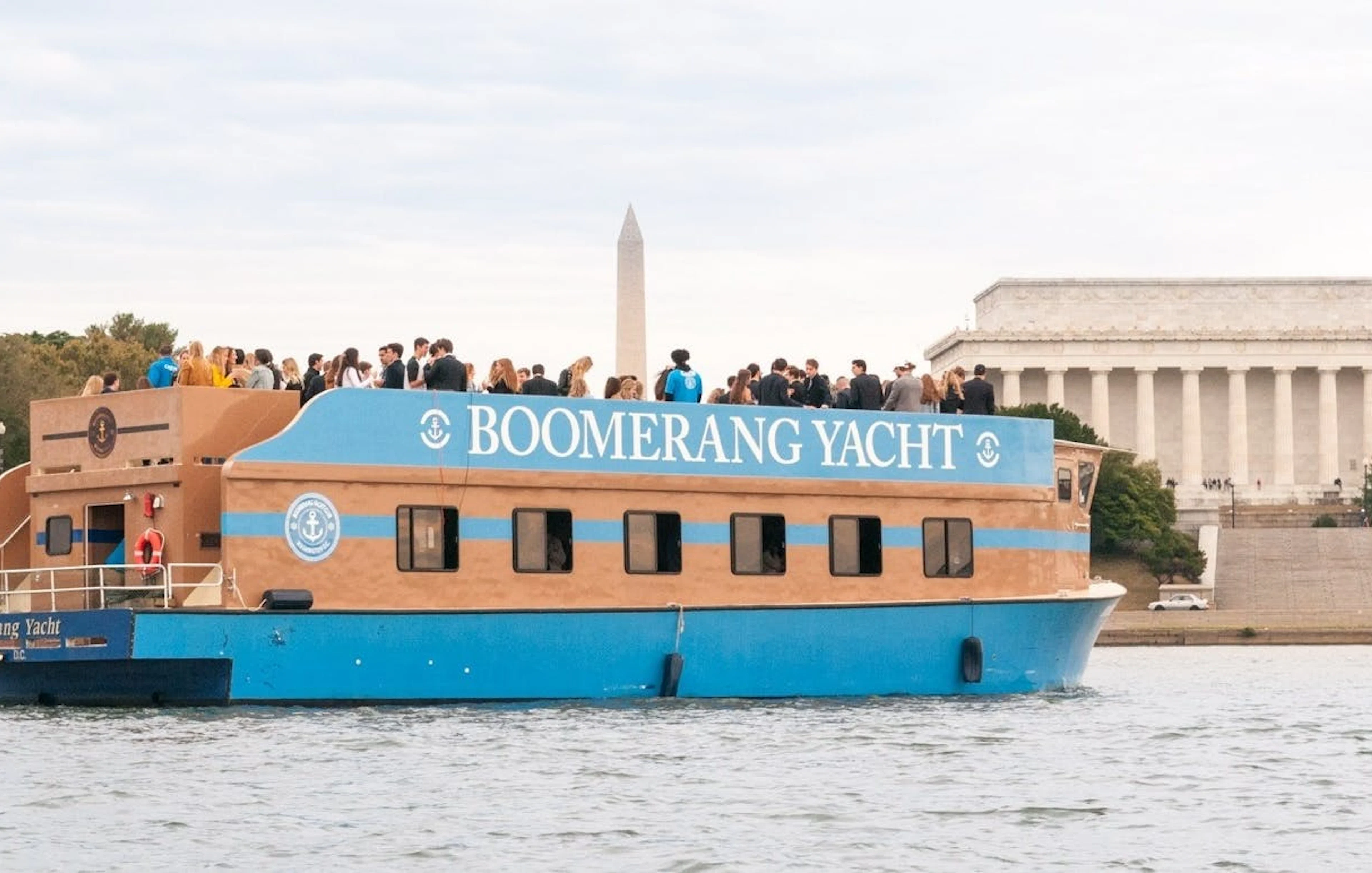Yacht cruise with guests near Washington Monument and Lincoln Memorial, Washington, DC.