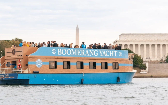 Yacht cruise with guests near Washington Monument and Lincoln Memorial, Washington, DC.