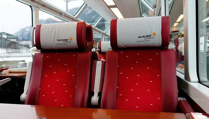 Two second class adjacent to each other, clicked from the other end of the table inside the Swiss Glacier Express