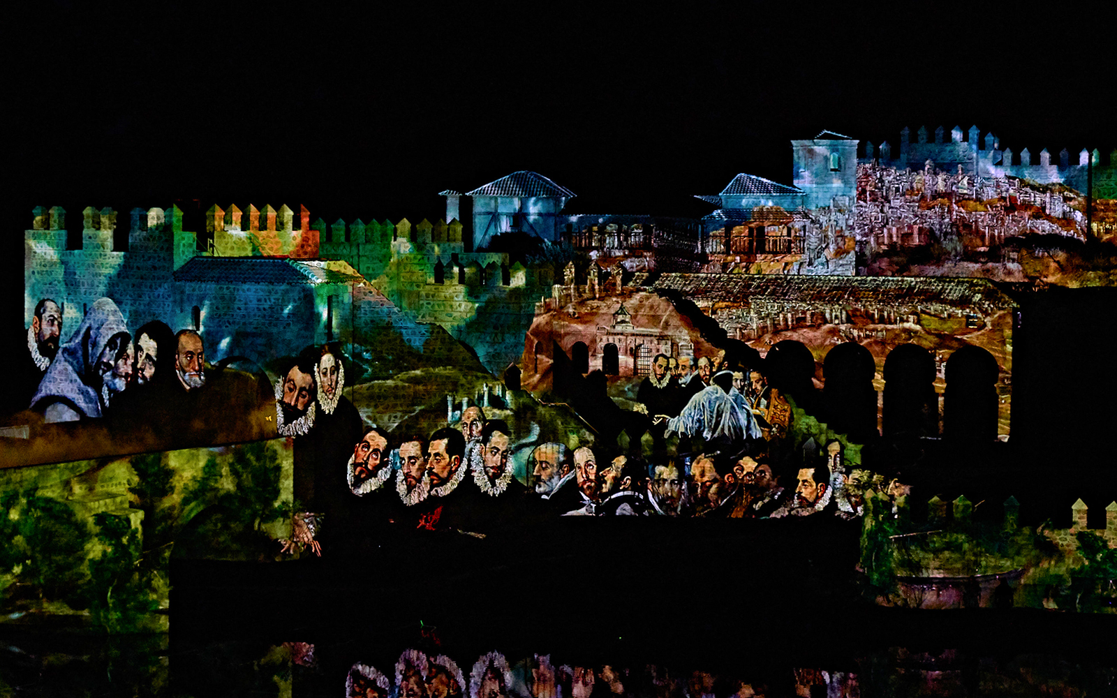 Projection of historical scenes on Toledo's ancient walls during "El Sueño de Toledo" show.