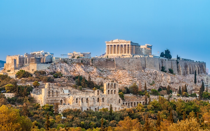 Acropolis in Athens with surrounding landmarks, viewed from an open-top bus tour.