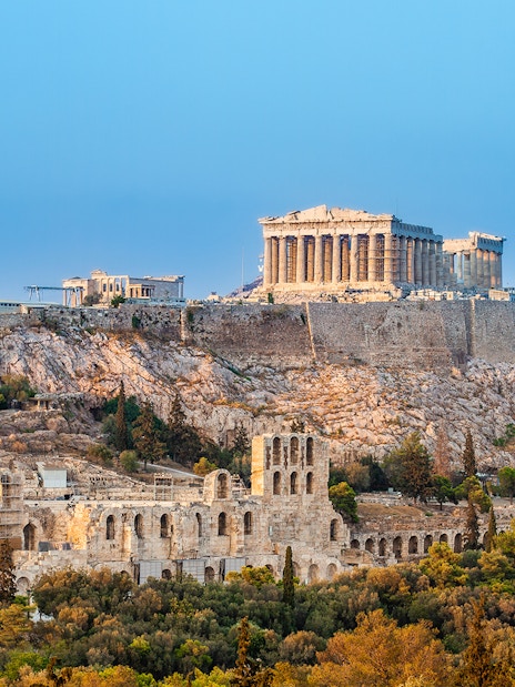 Acropolis in Athens with surrounding landmarks, viewed from an open-top bus tour.
