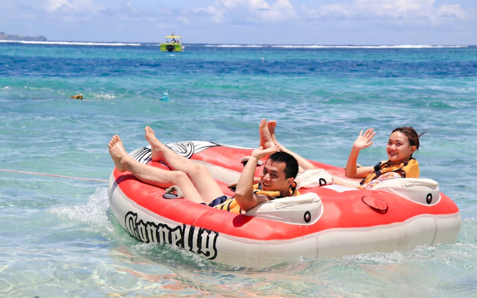 Tubing adventure on the east coast of Mauritius with two people enjoying the ocean.