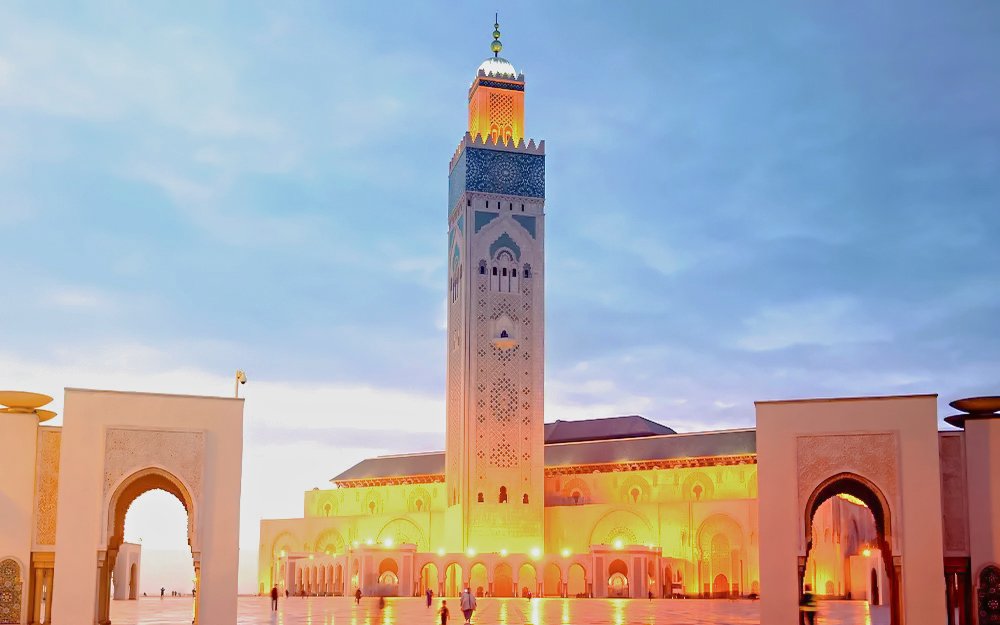 Hassan II Mosque illuminated at night in Casablanca, Morocco.