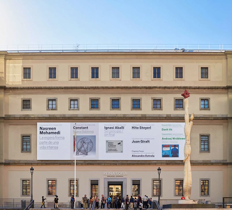 Reina Sofia Museum entrance with visitors in Madrid, Spain.
