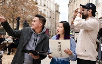 Group exploring Prague with Mystery City Games map.