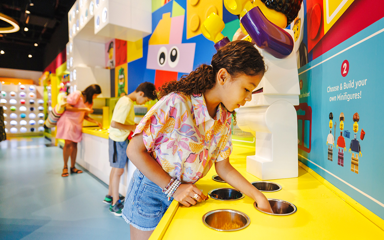 Guests building minifigures at Legoland New York.
