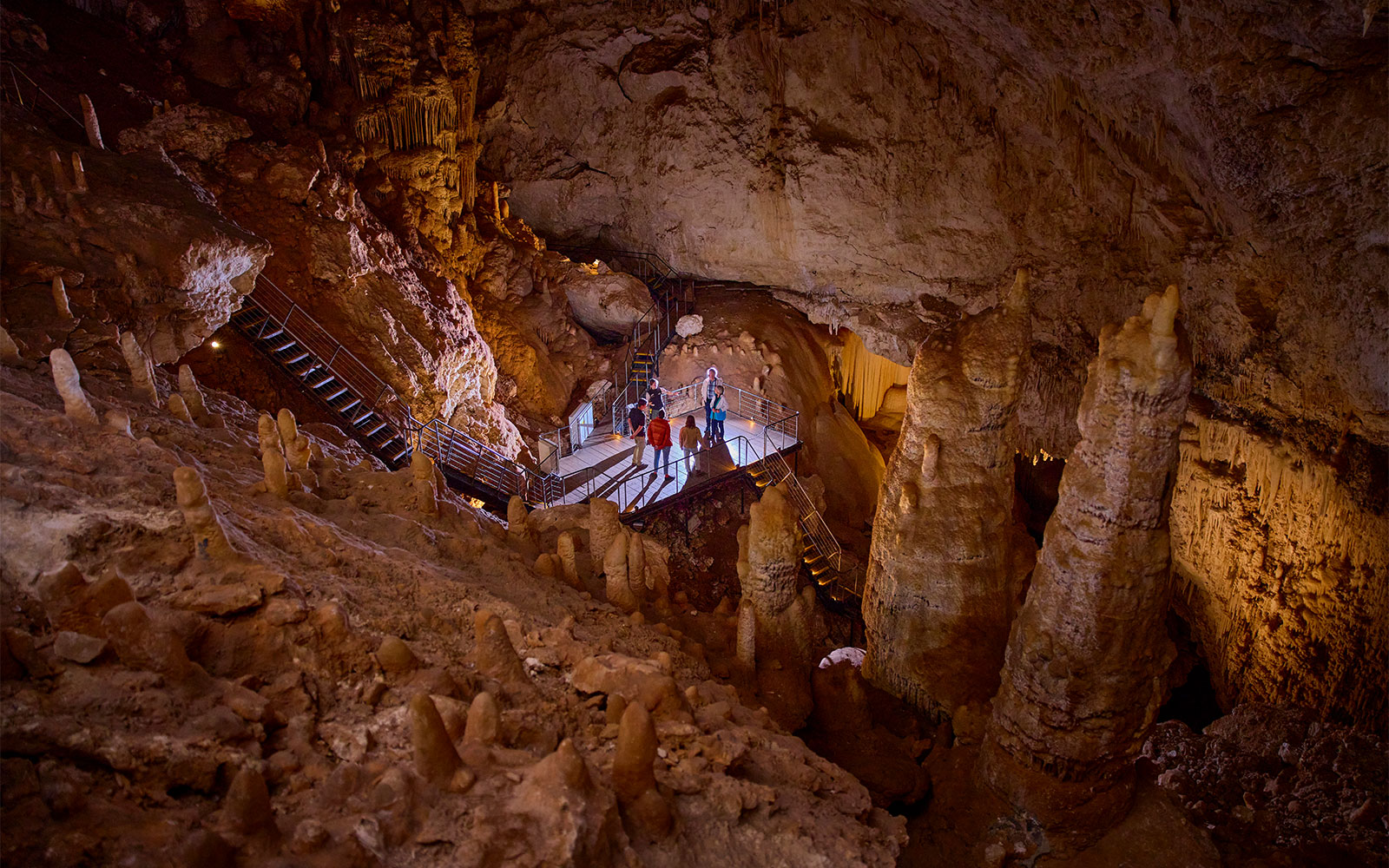 Visitors exploring stalactites and stalagmites in Jewel Cave, Margaret River.