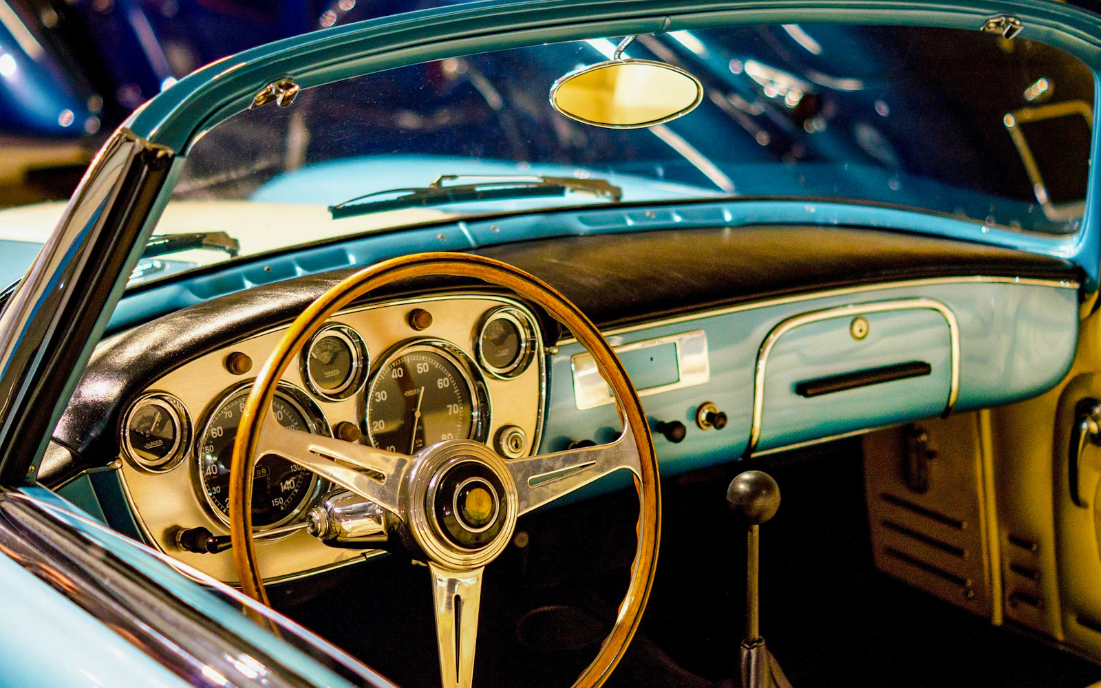 Vintage car dashboard with wooden steering wheel, part of The Sunrise Vintage Experience in Cappadocia.