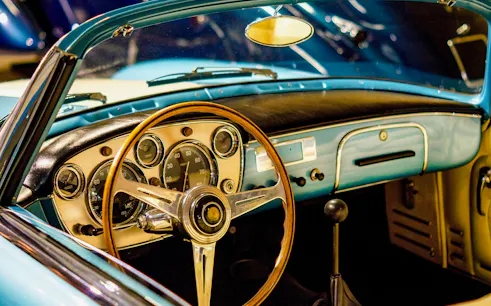 Vintage car dashboard with wooden steering wheel, part of The Sunrise Vintage Experience in Cappadocia.