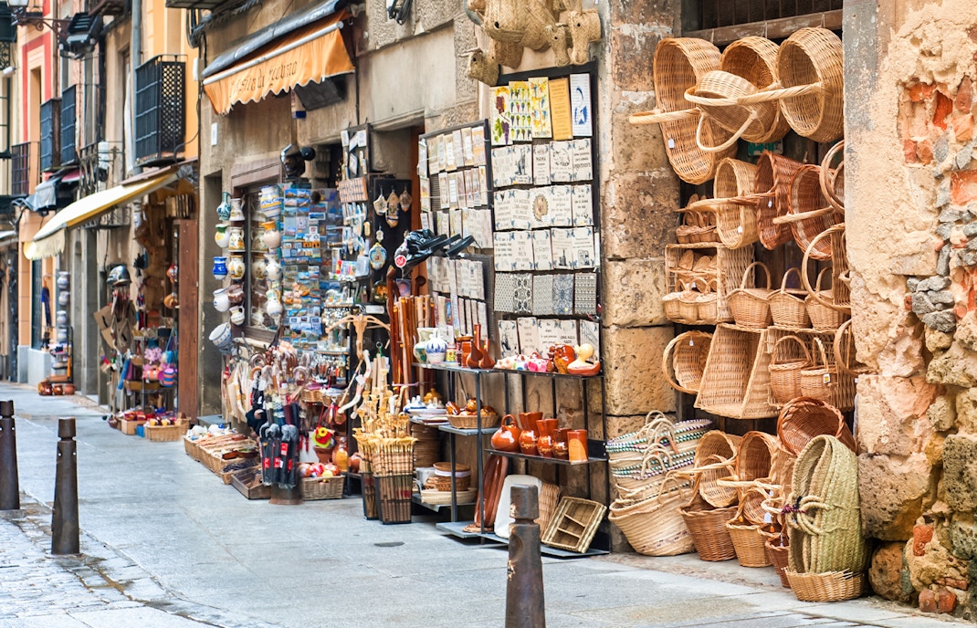 Souvenir shops with baskets and crafts in Segovia old town.