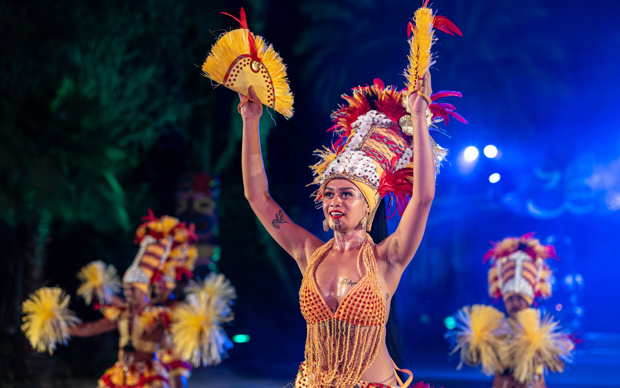 Performer in traditional costume during night dance at PortAventura.