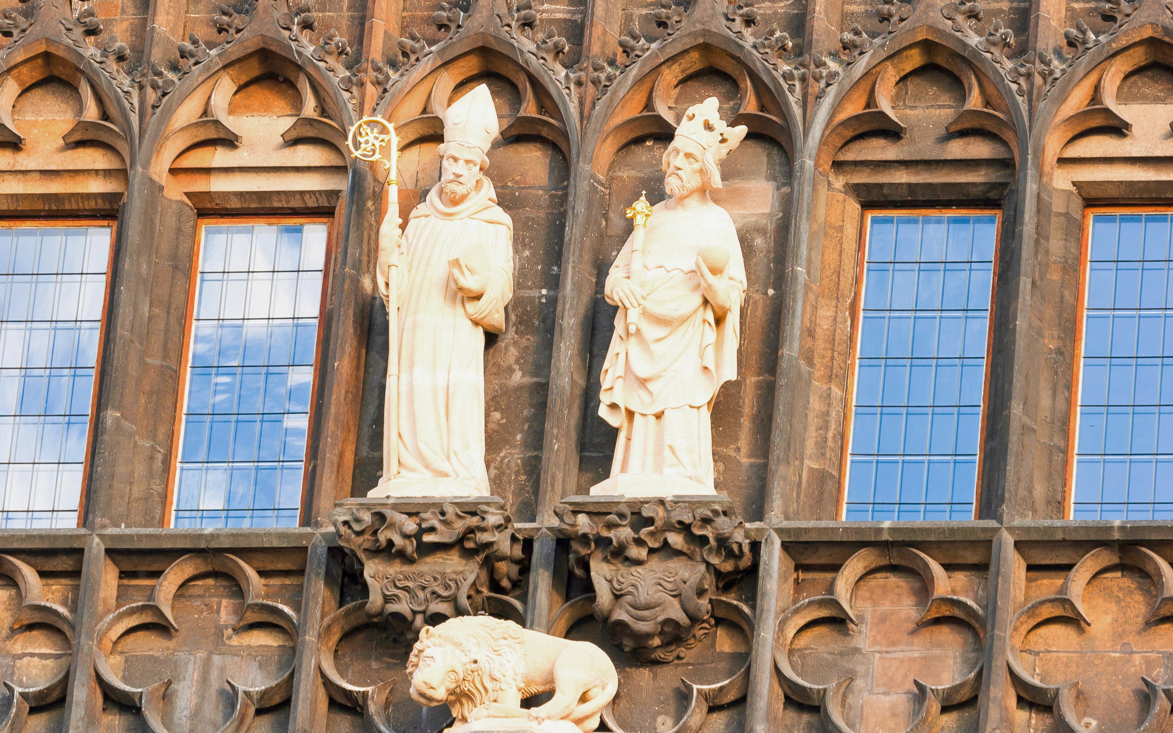 Statues on the Old Town Bridge Tower in Prague, featuring historical figures.