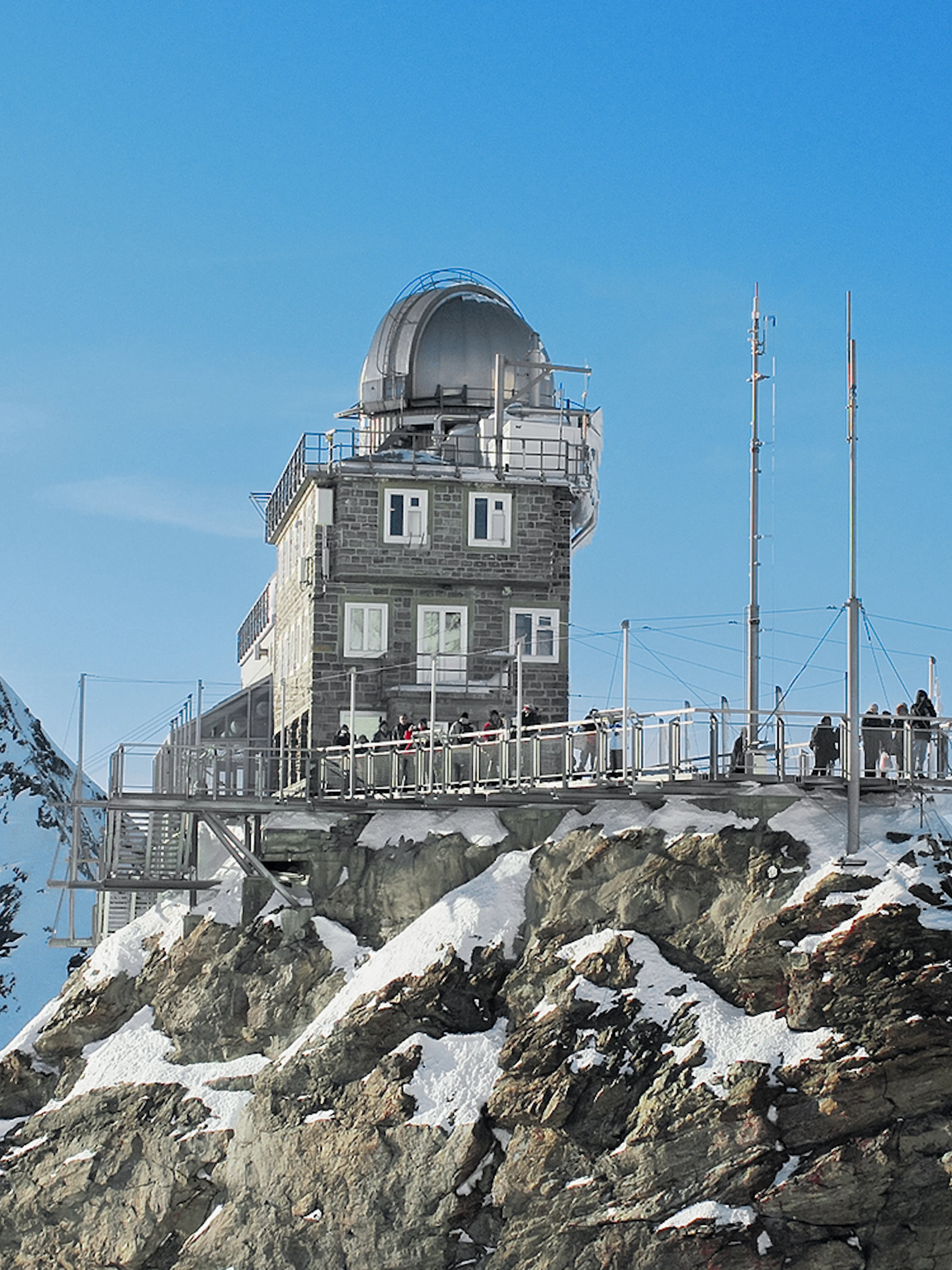 Jungfraujoch observatory on snowy peak, accessible with Swiss Travel Pass.