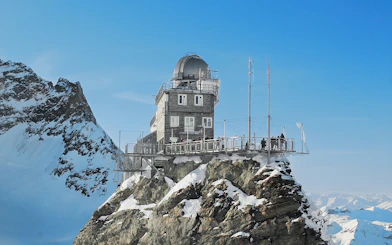 Jungfraujoch observatory on snowy peak, accessible with Swiss Travel Pass.