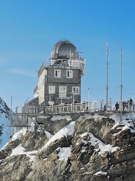 Jungfraujoch observatory on snowy peak, accessible with Swiss Travel Pass.