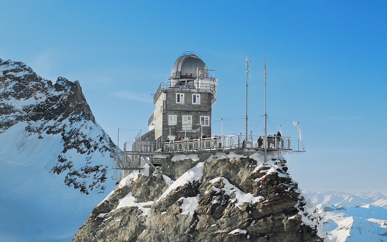 Jungfraujoch observatory on snowy peak, accessible with Swiss Travel Pass.