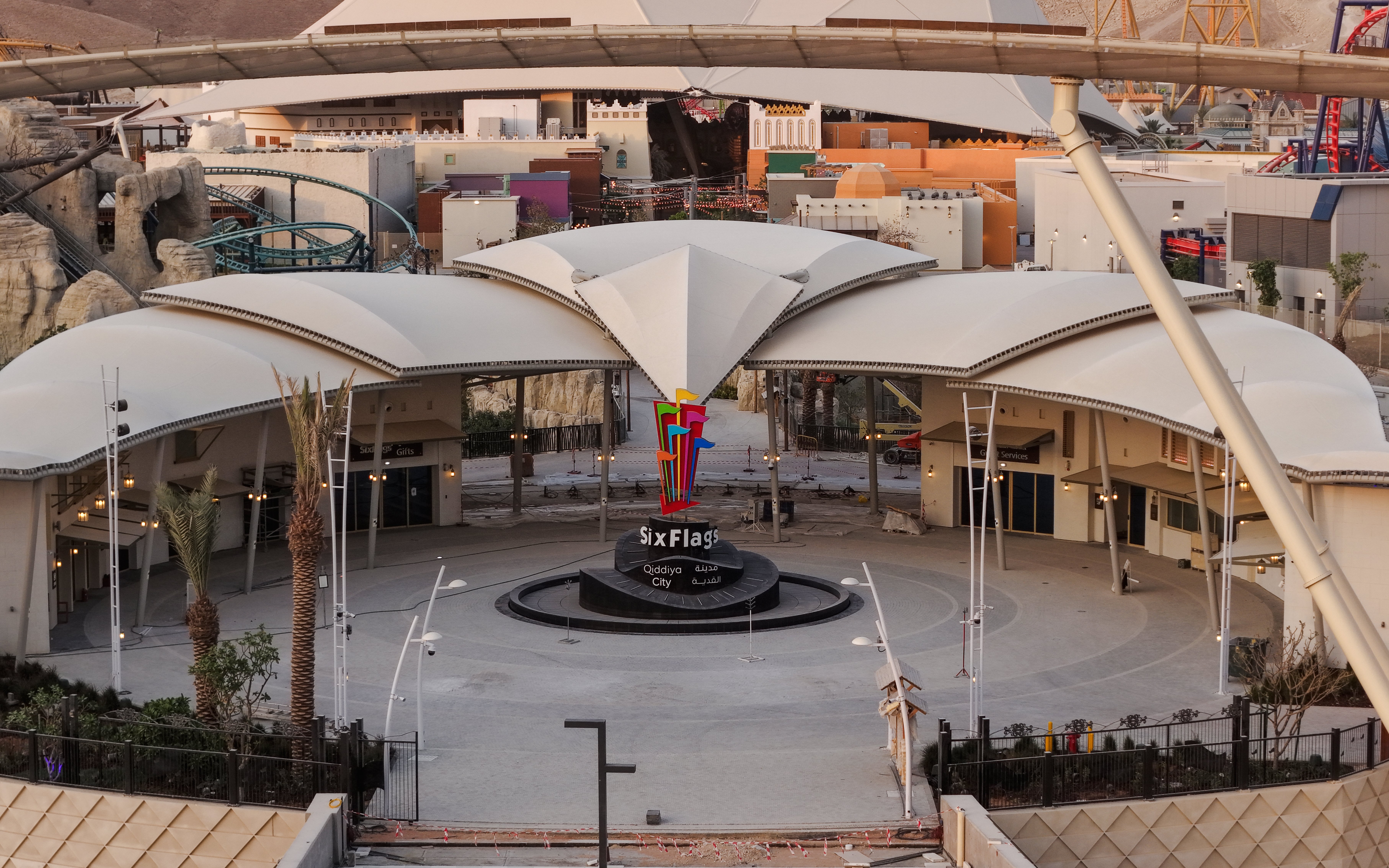 Six Flags Qiddiya City entrance with modern architecture and colorful logo.