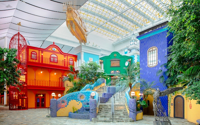 Colorful buildings and sculptures inside Ghibli Park's Grand Warehouse, Japan.