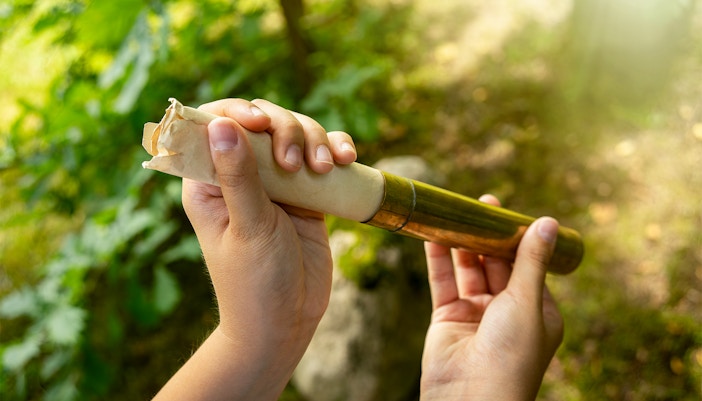 Time capsule being buried in a park, symbolizing a message to the future.