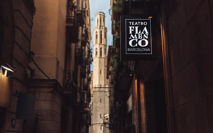 Teatro Flamenco Barcelona sign in a narrow street with historic architecture.