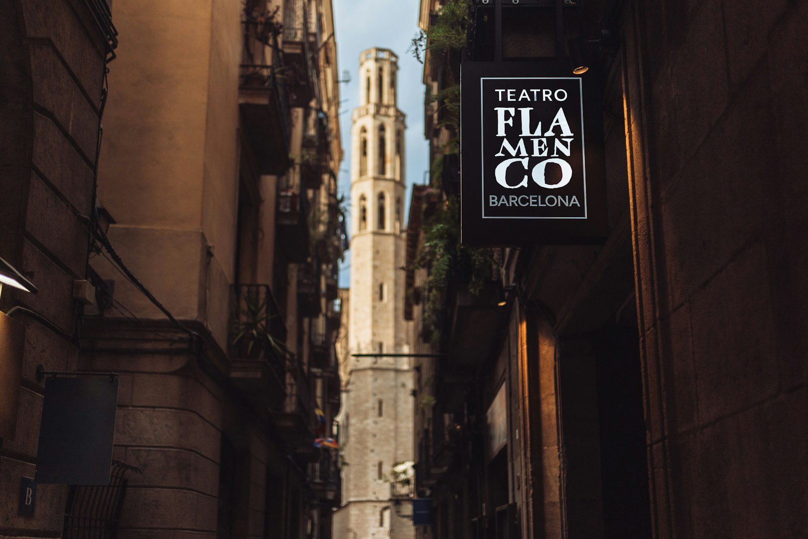Teatro Flamenco Barcelona sign in a narrow street with historic architecture.