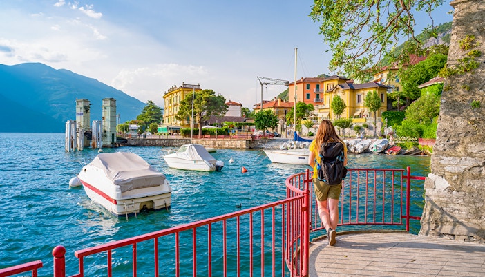 Walk of Lovers path along Lake Como in Varenna, Italy, with scenic views of the lake and surrounding mountains.