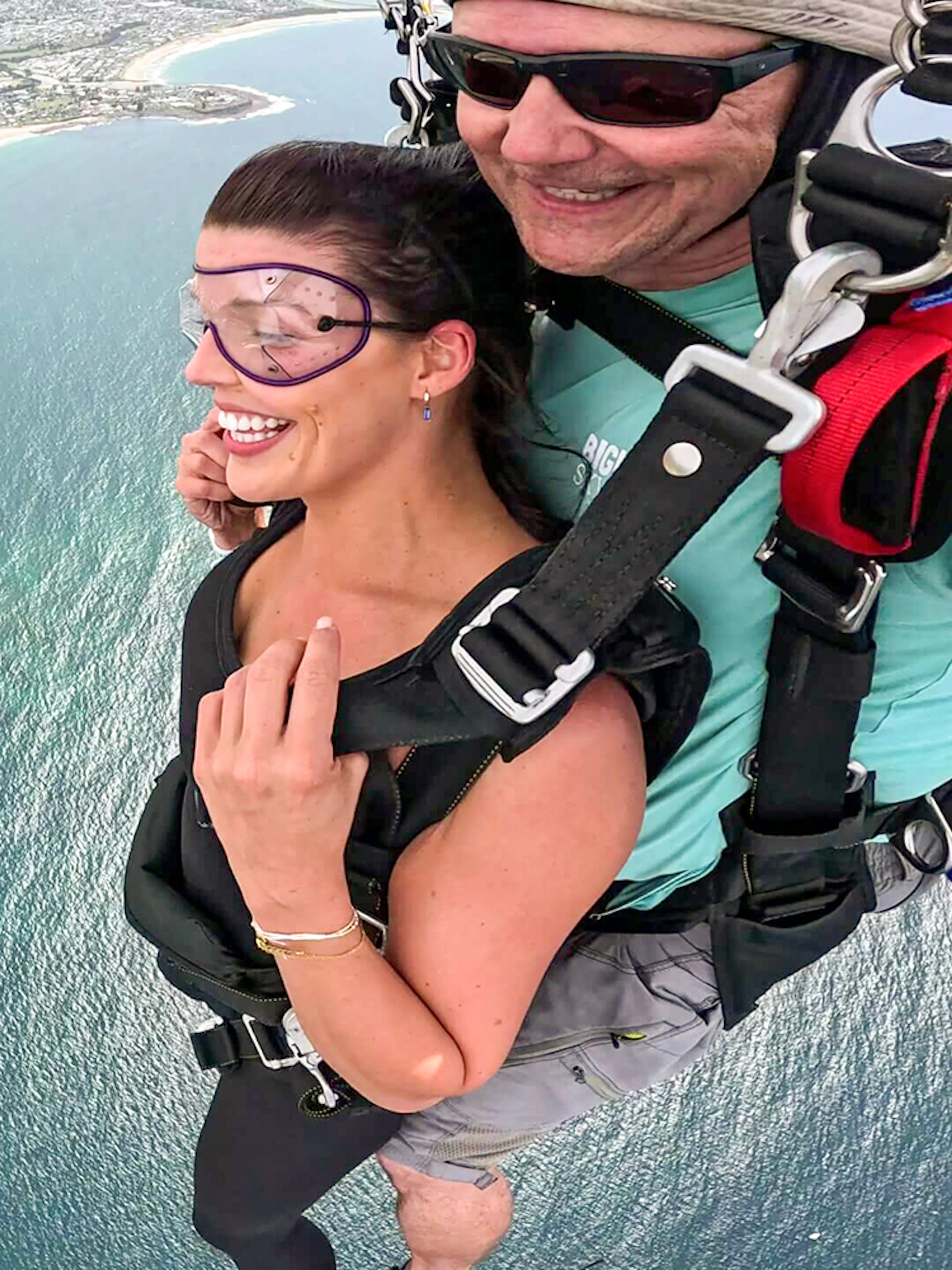 Tandem skydive over Shellharbour, Sydney, with coastal view from 15,000 feet.