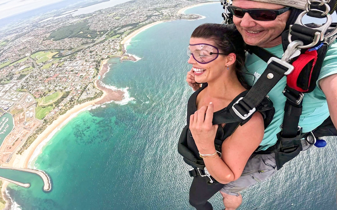 Tandem skydive over Shellharbour, Sydney, with coastal view from 15,000 feet.