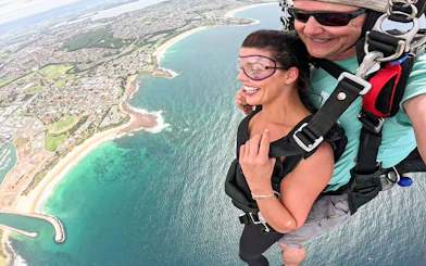 Tandem skydive over Shellharbour, Sydney, with coastal view from 15,000 feet.