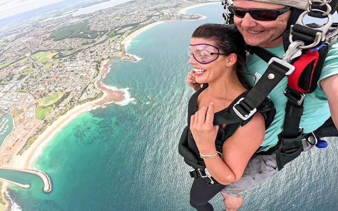 Tandem skydive over Shellharbour, Sydney, with coastal view from 15,000 feet.
