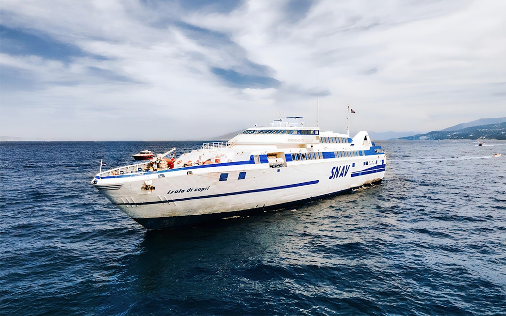 SNAV ferry sailing between Naples and Capri on a clear day.