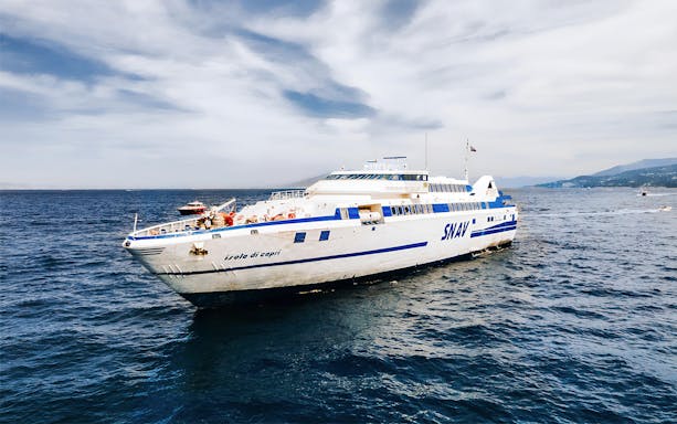 SNAV ferry sailing between Naples and Capri on a clear day.
