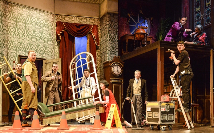 Cast members on stage during a chaotic scene from "The Play That Goes Wrong.