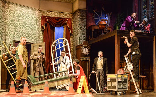 Cast members on stage during a chaotic scene from "The Play That Goes Wrong.