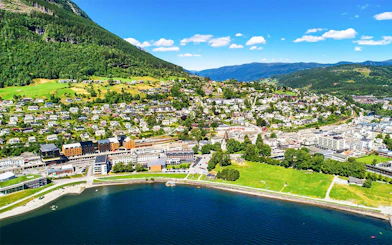 Aerial view of Voss village in Vestland County, featuring lush greenery and waterfront.