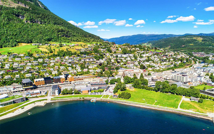 Aerial view of Voss village in Vestland County, featuring lush greenery and waterfront.