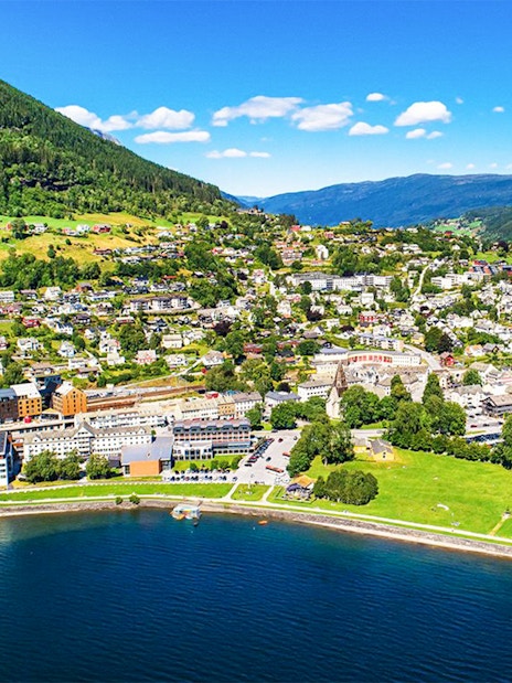 Aerial view of Voss village in Vestland County, featuring lush greenery and waterfront.