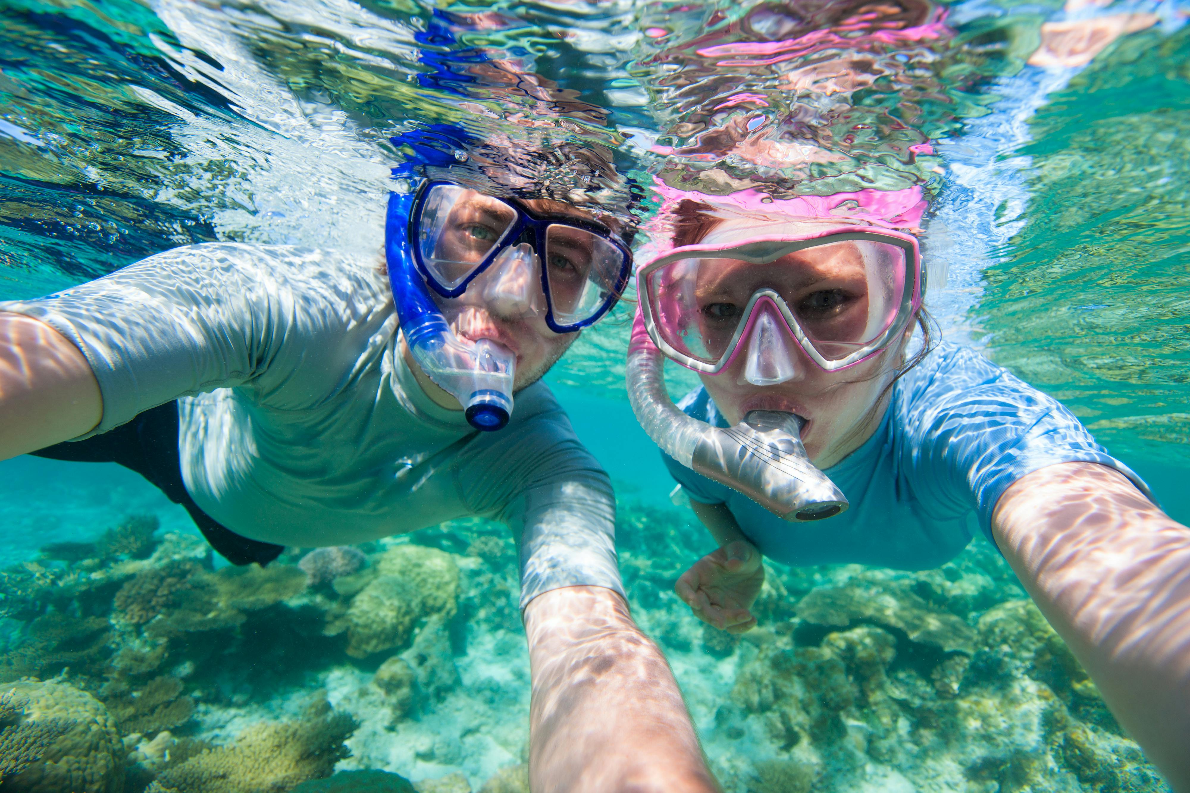 Snorkelers exploring coral reefs at Giftun Island, Hurghada.