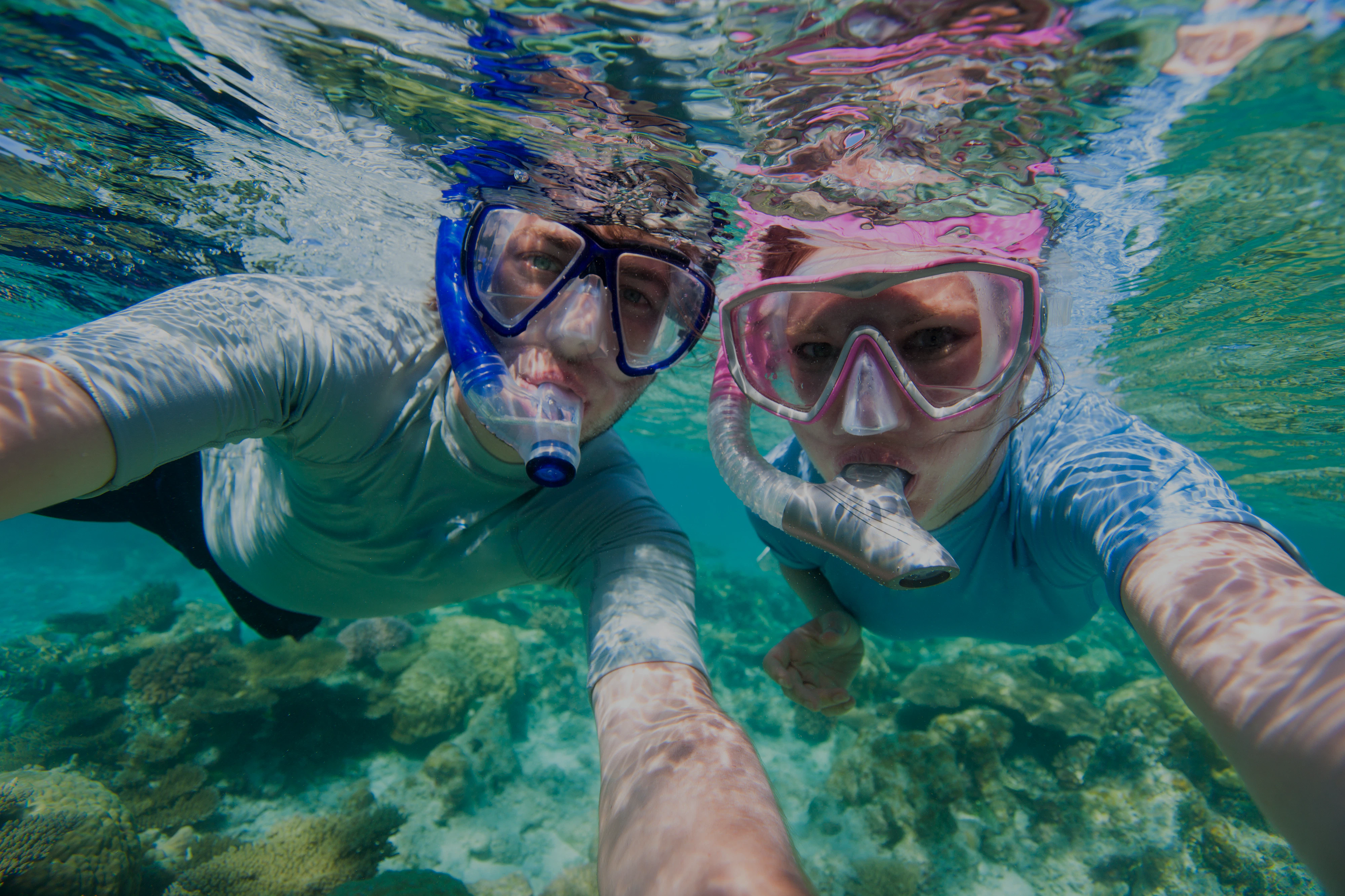 Snorkelers exploring coral reefs at Giftun Island, Hurghada.