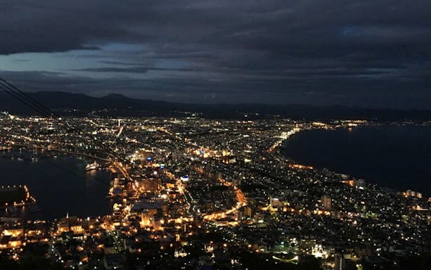Night view of Hakodate city lights from Mt. Hakodate, Japan, seen from a chartered sightseeing car.