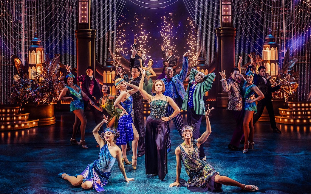 Stage performance of The Great Gatsby in New York with dancers in 1920s attire.