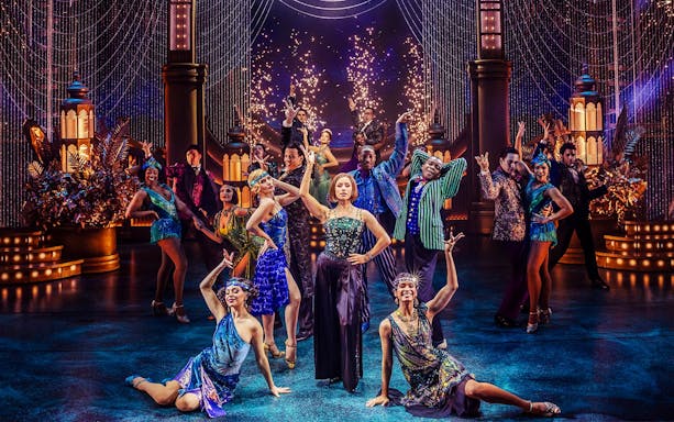 Stage performance of The Great Gatsby in New York with dancers in 1920s attire.