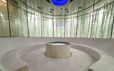 Circular sauna room with central stone feature at Aqua field, VinPearl Harbour, Nha Trang, Vietnam.